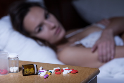 Sleeping pills on bedside table